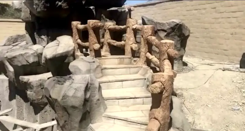 Rock-textured steps and boulders being formed by hand