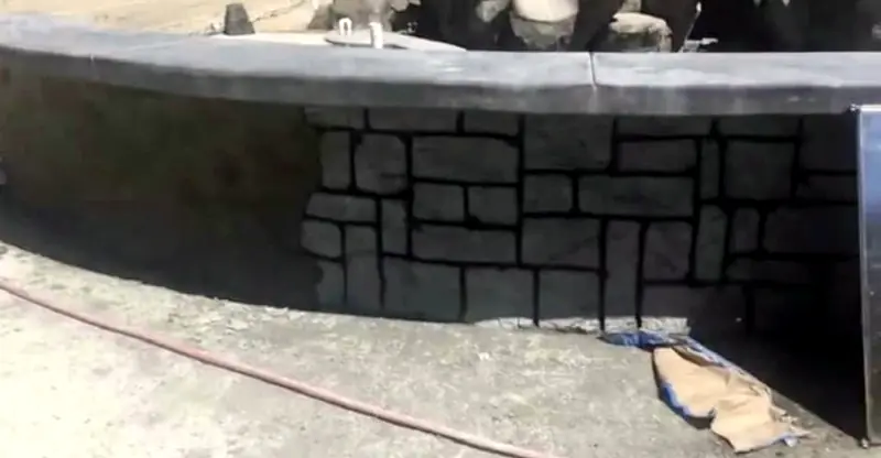 Stone veneer going onto a raised wall