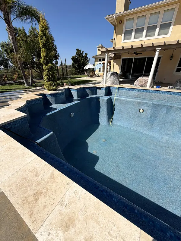 Fresh interior finish and tiled steps in the empty pool